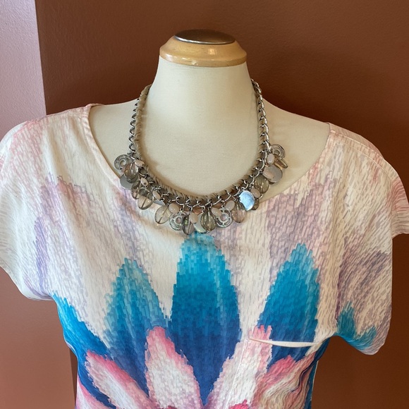 Nygard necklace intertwined with ribbon and silver and pink bangles. - Picture 3 of 6